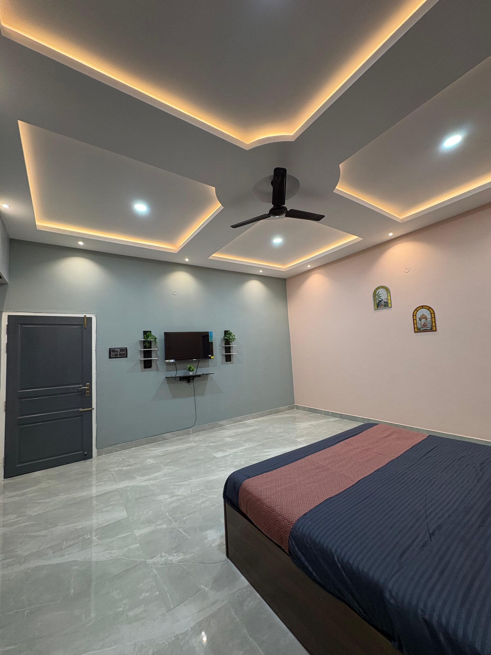 pink bedroom with tv